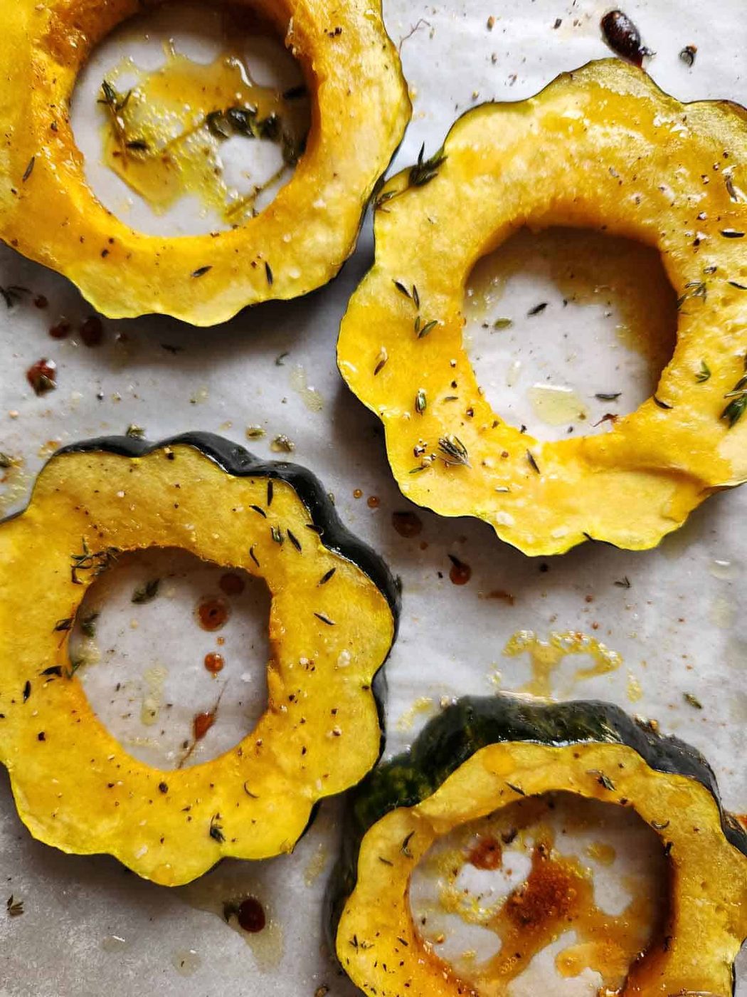 Four cooked acorn squash rings.