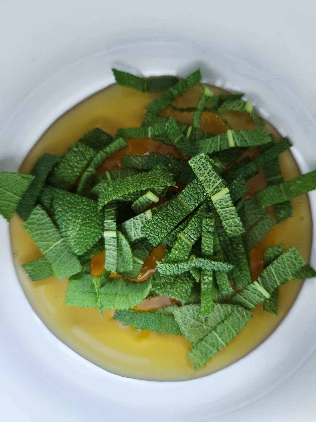 Sage and honey in a small pot.