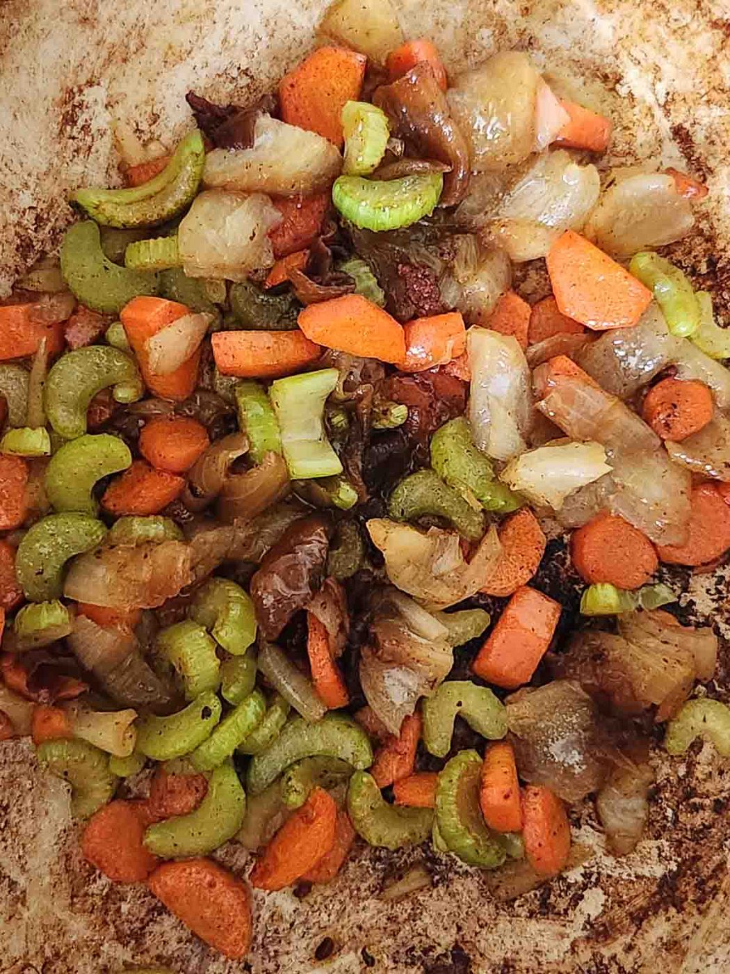 Sauteed vegetables in a pot.