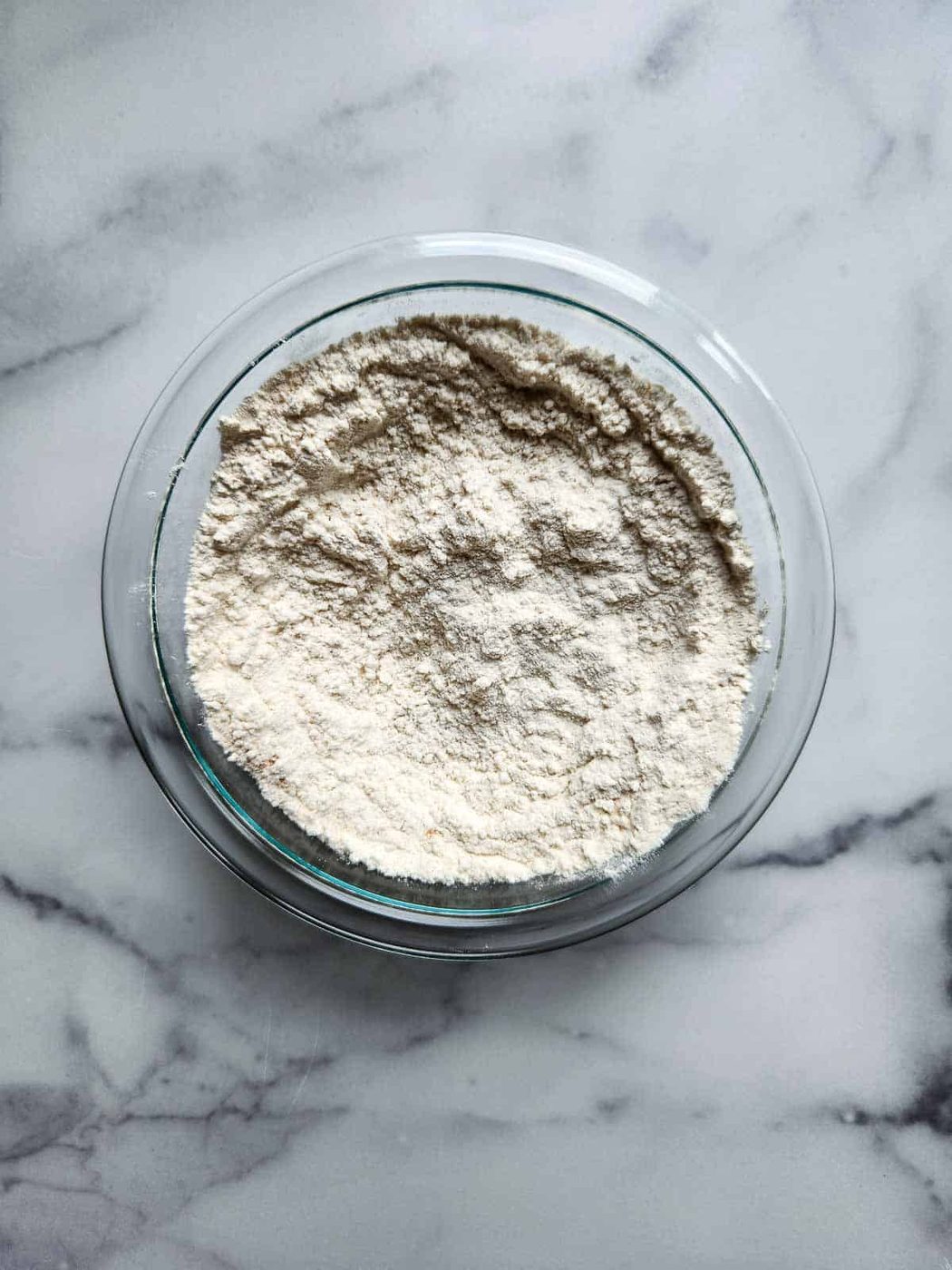Dry ingredients for banana bread in a bowl.