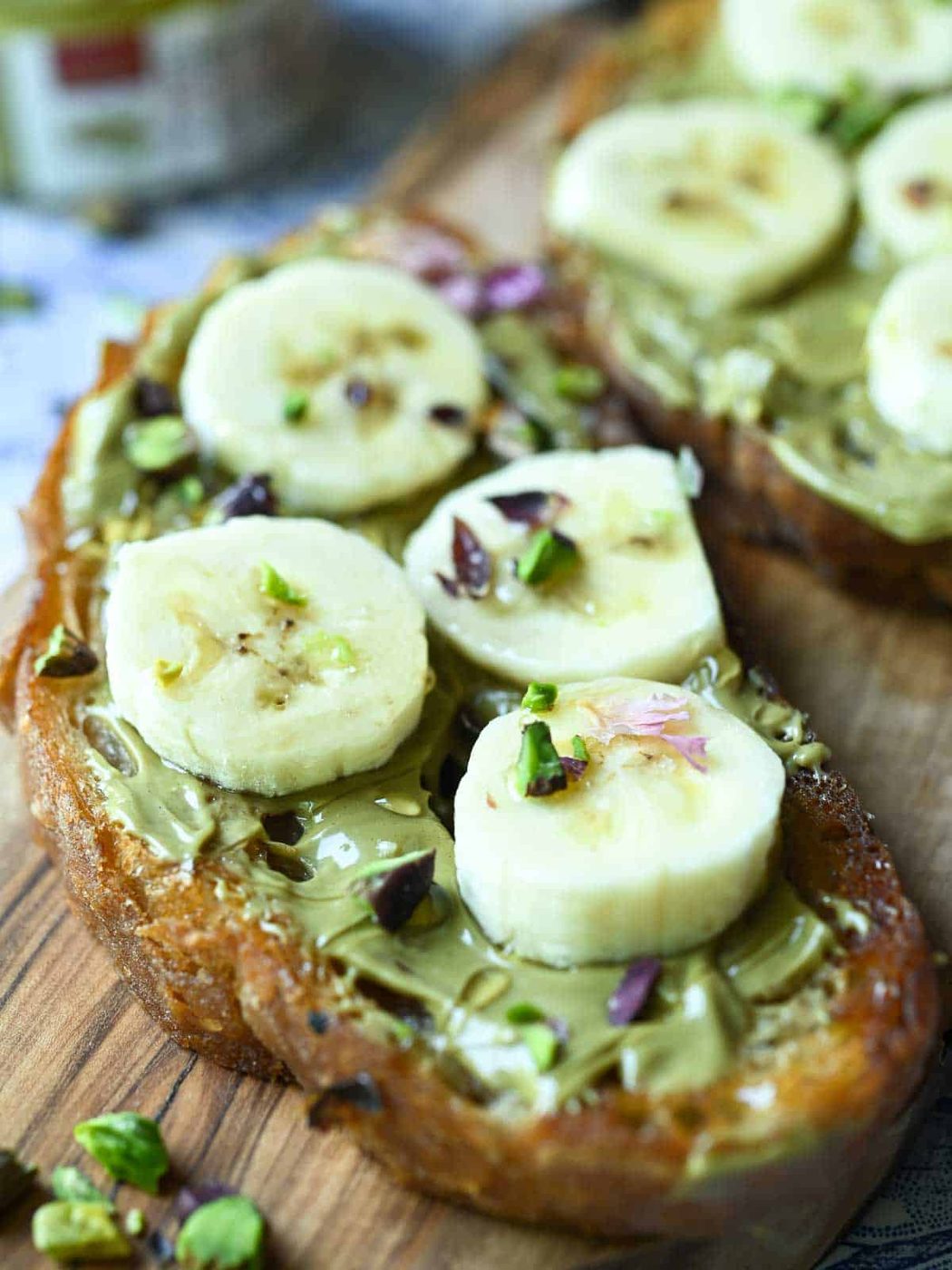 Banana Toast, plus Pistachio Cream on a wood surface.