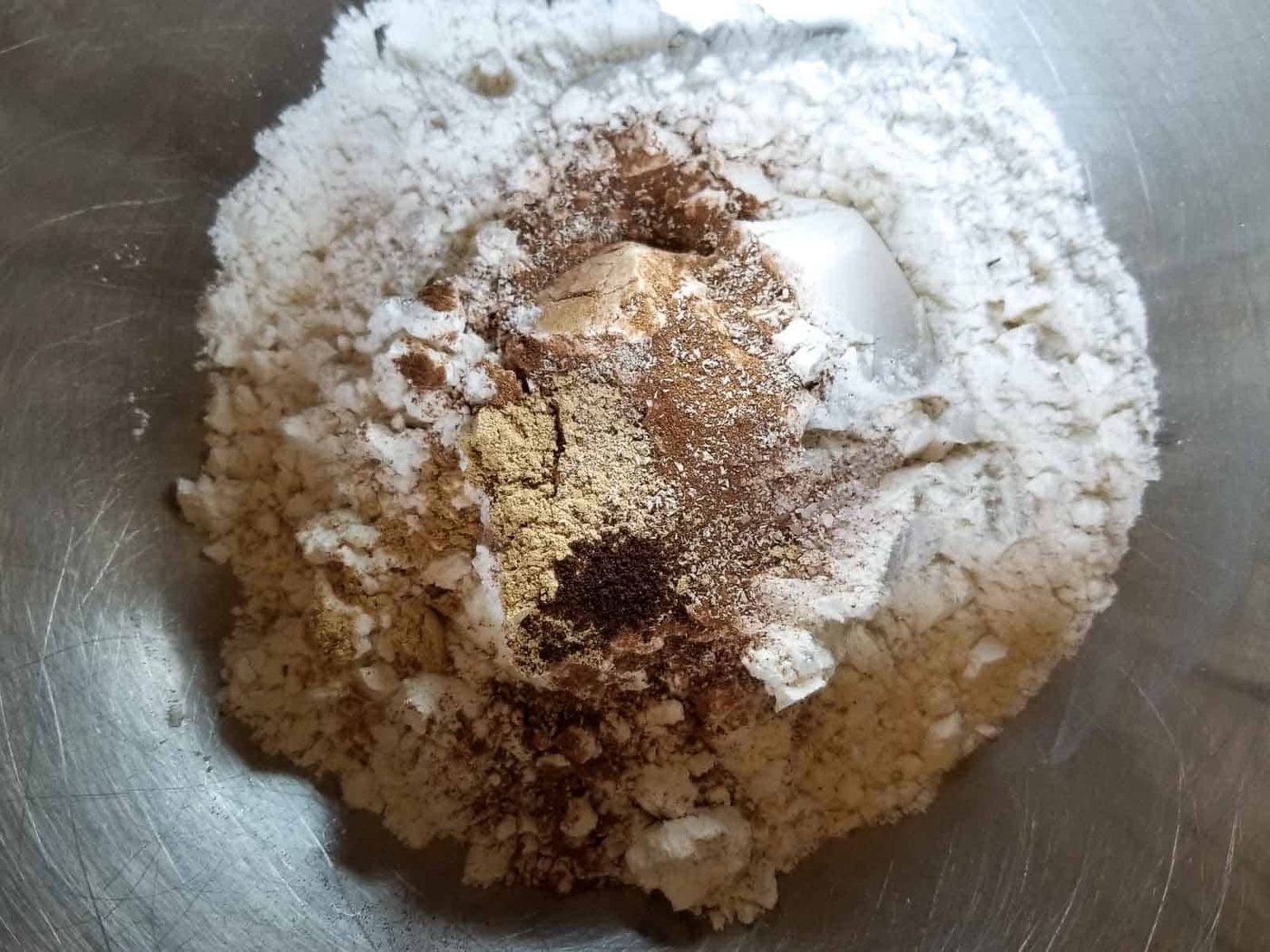 Dry ingredients for pumpkin waffles in a bowl.