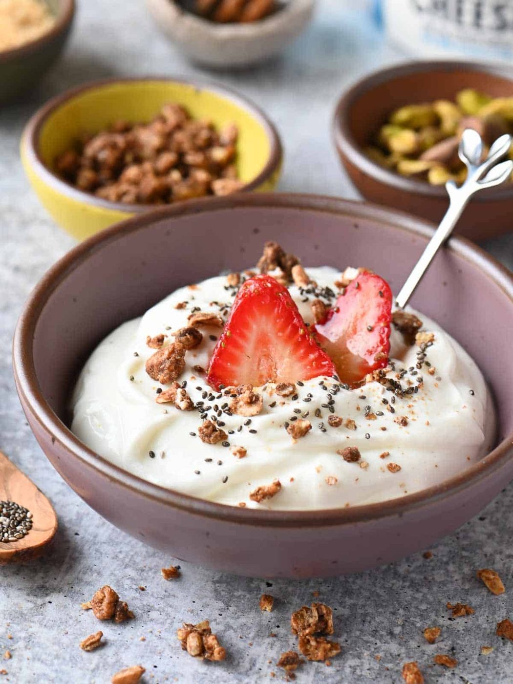 Cottage cheese bowls with various toppings in a purple bowl.