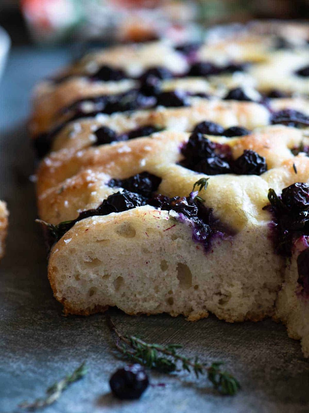 A close-up of a cross section of blueberry focaccia.