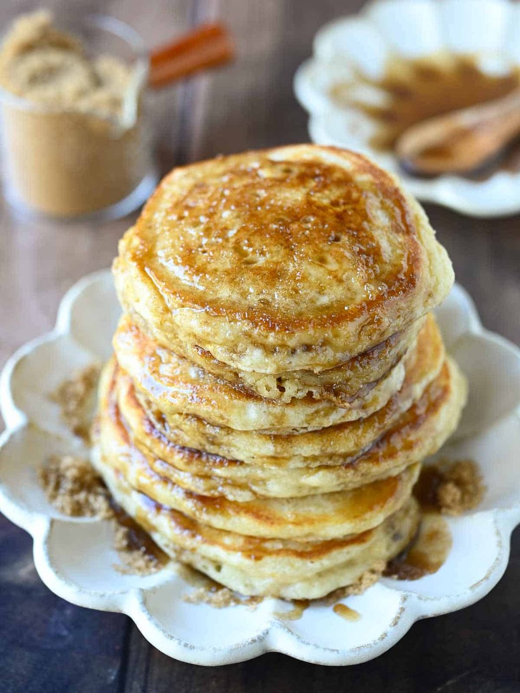 Brown sugar pancakes stacked on a beige plate.