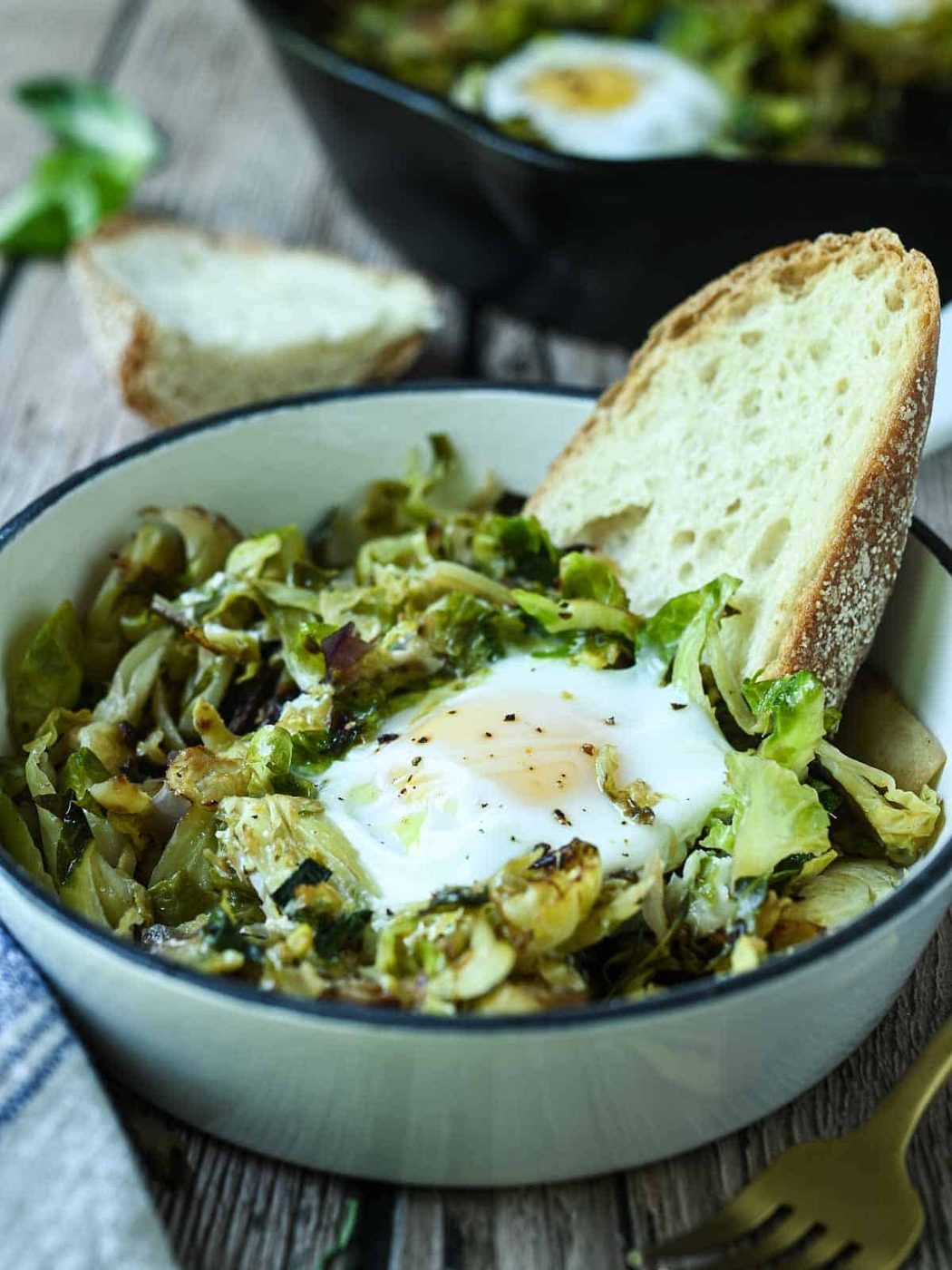 Brussel spout hash in a mini skillet with eggs and toast.