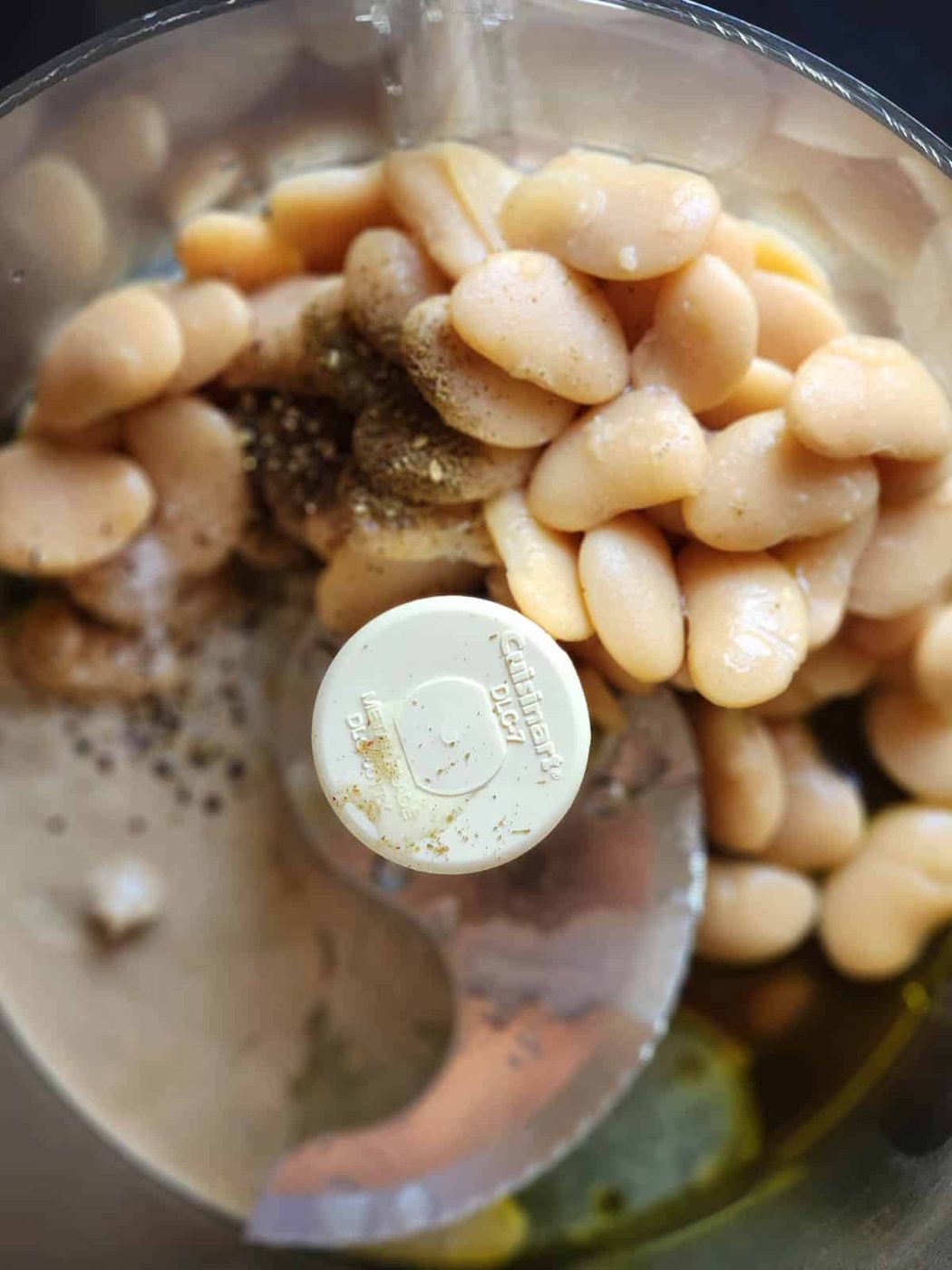 Ingredients for butter bean hummus in a food processor.