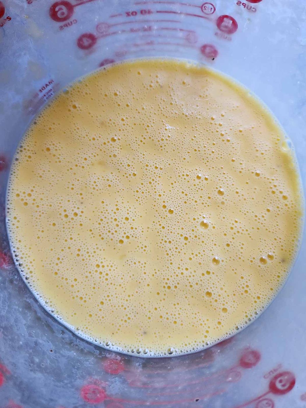 Egg and buttermilk mixture in a bowl.