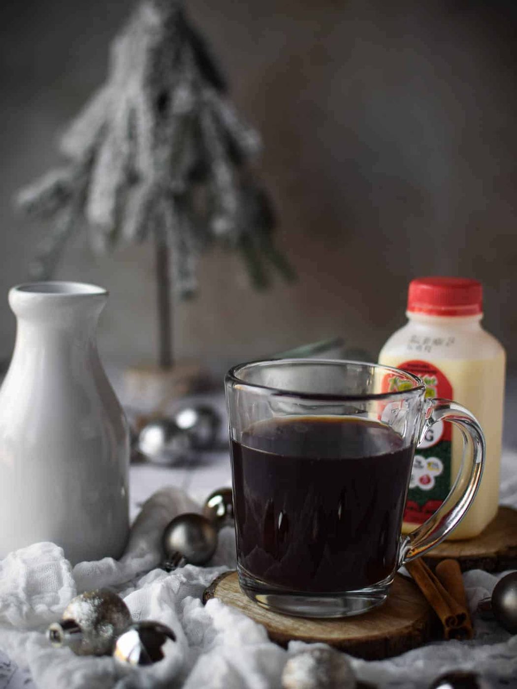Chai concentrate in a clear mug on a light background.