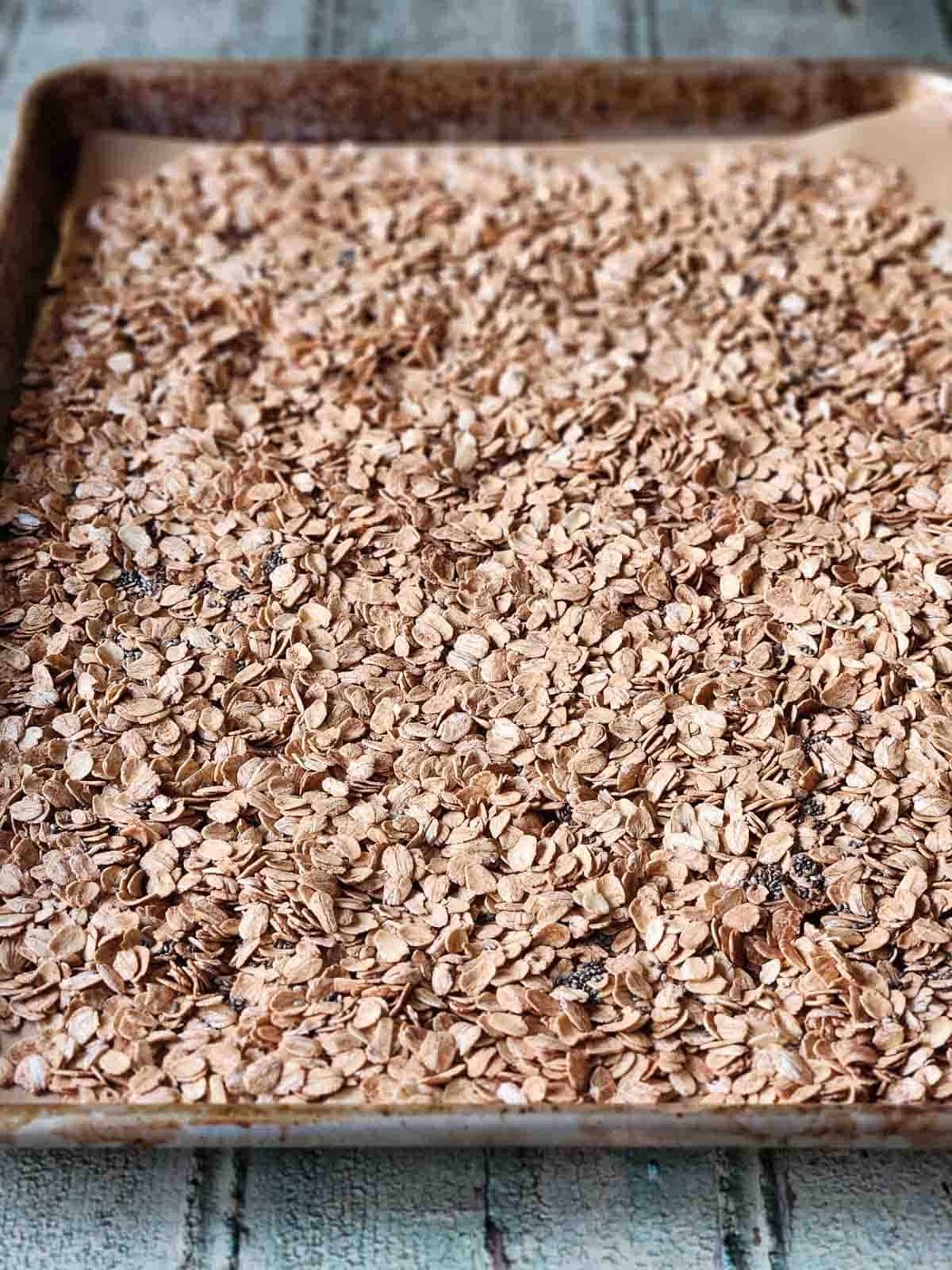 Toasted oats on a baking sheet.