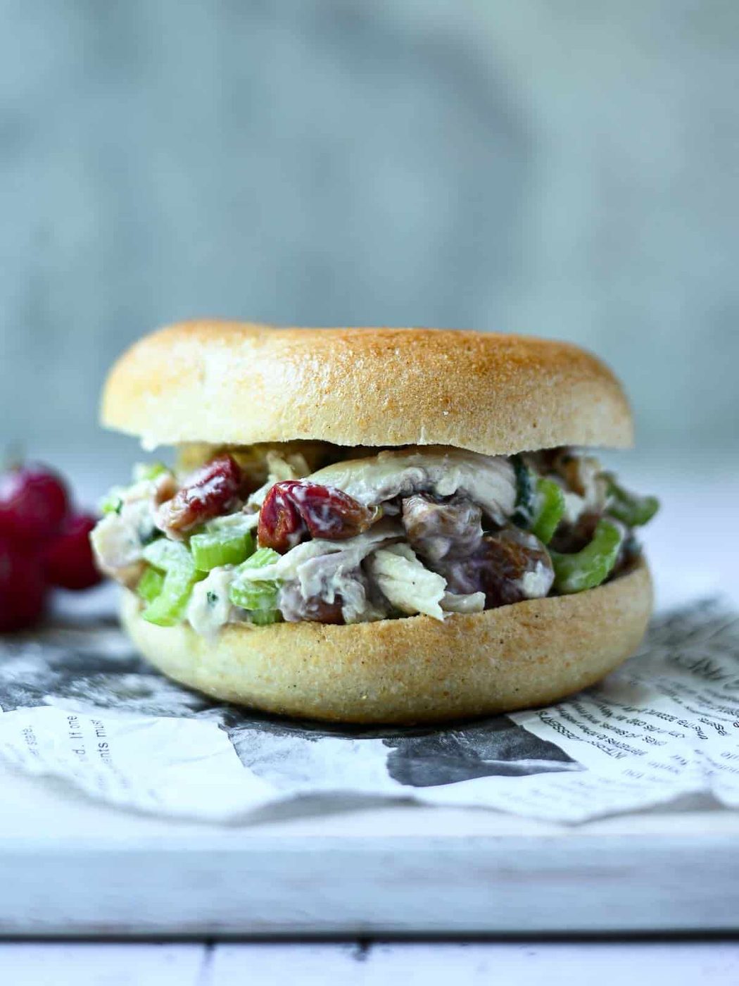 Chicken salad with grapes on a bagel.