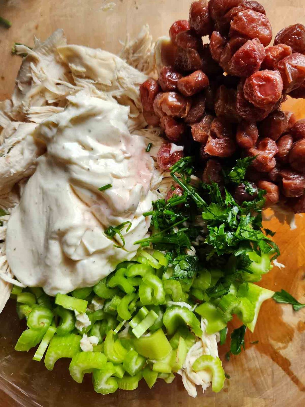 Ingredients for chicken salad in a bowl.