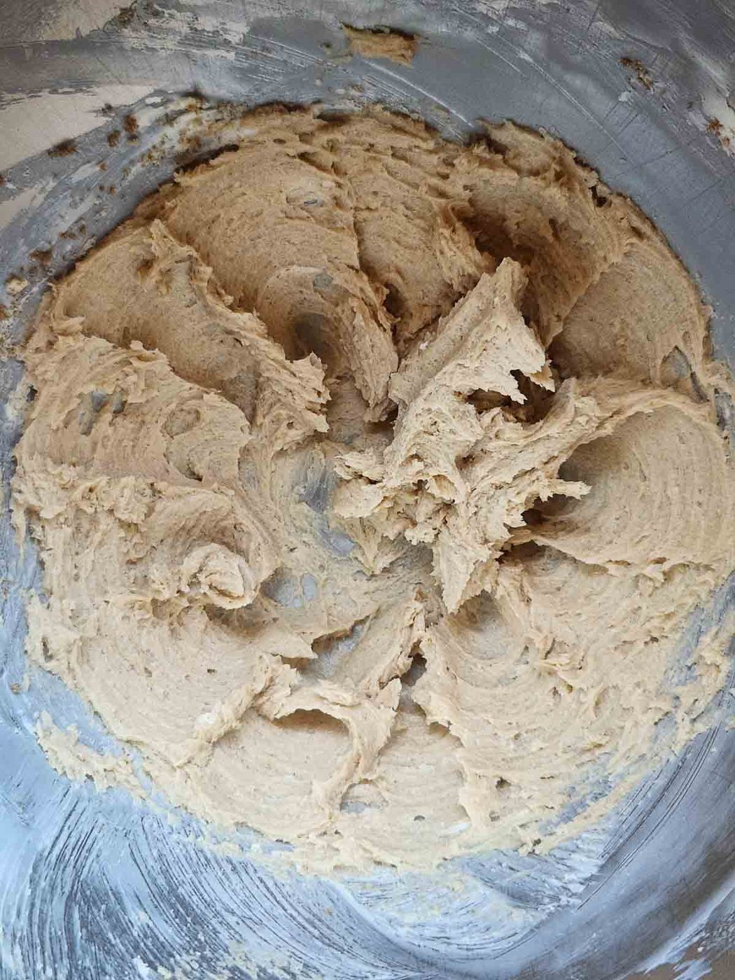 Batter for gingerbread loaf in a metal bowl.