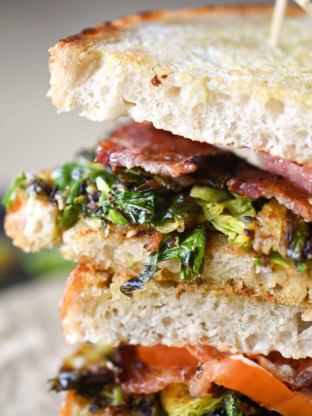 Close-up of Brussels sprouts tucked in a sandwich.