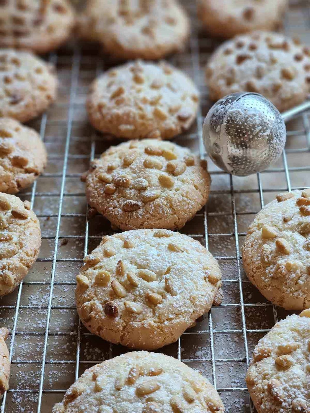 Dusted pignoli cookies with powdered sugar.