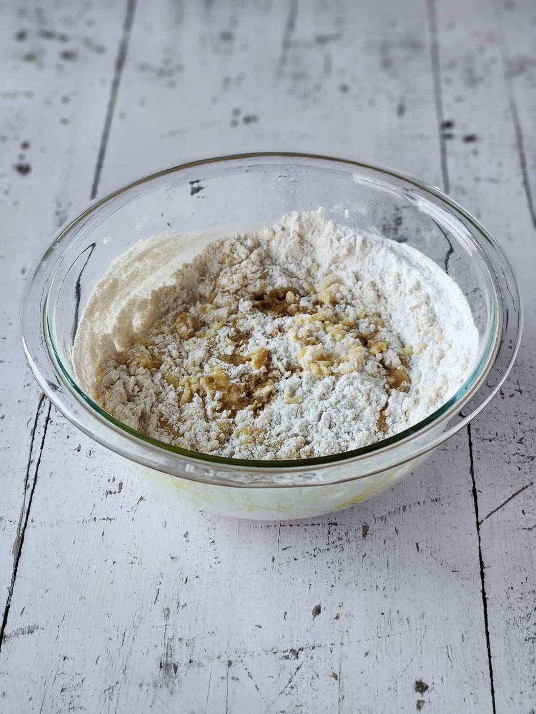 Flour and egg mixture in a clear bowl.