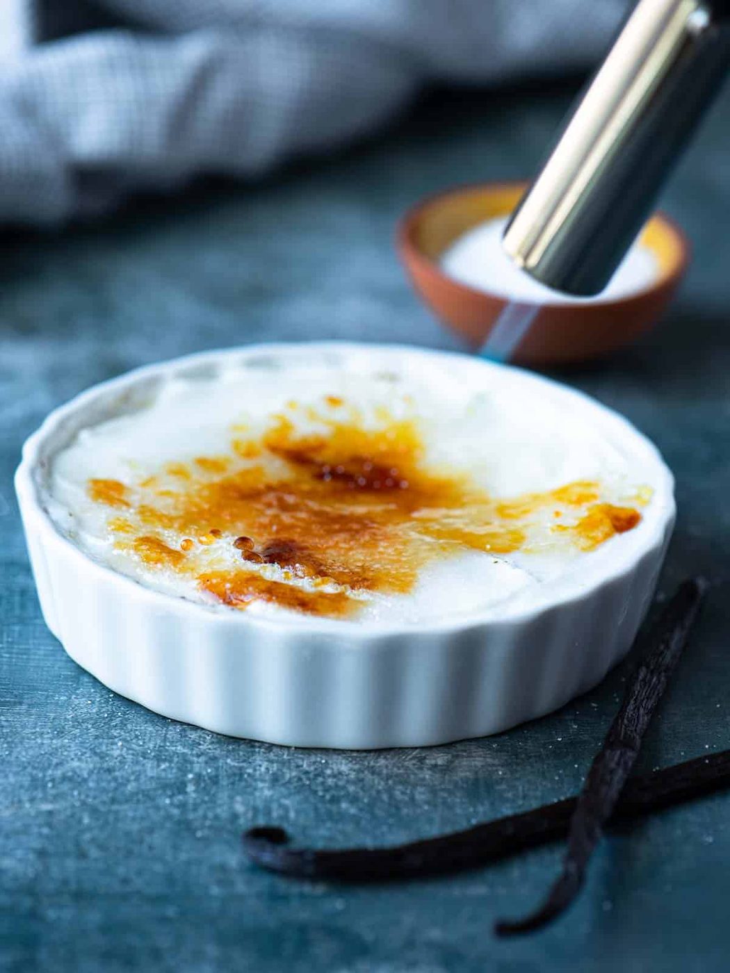 A flame swept over sugar to harden it for yogurt brulee.