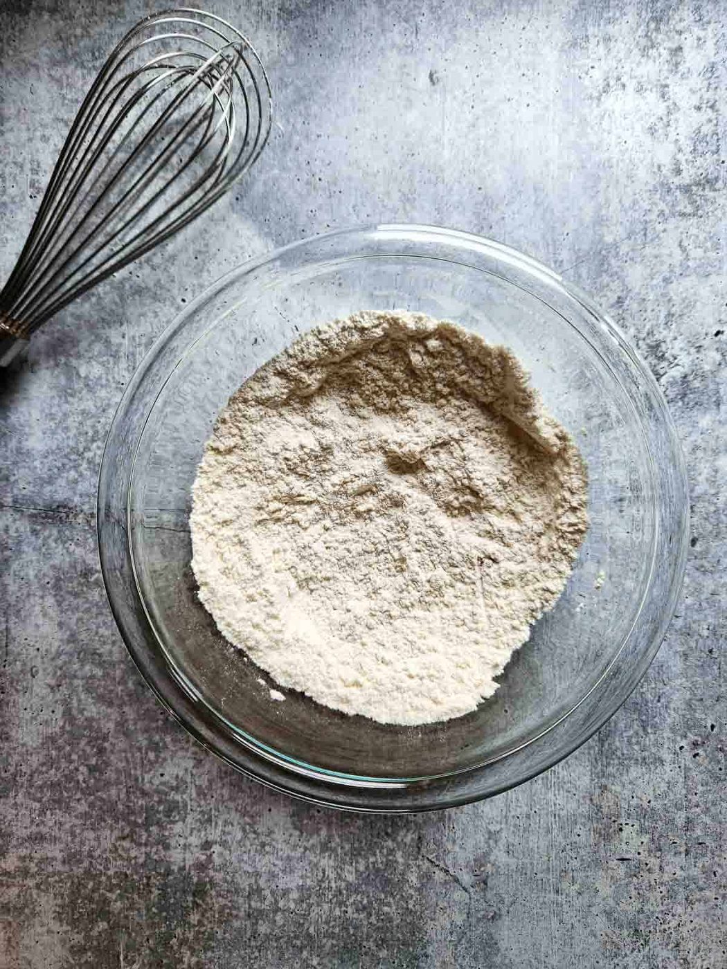 Dry ingredients in a bowl for eggnog waffles.