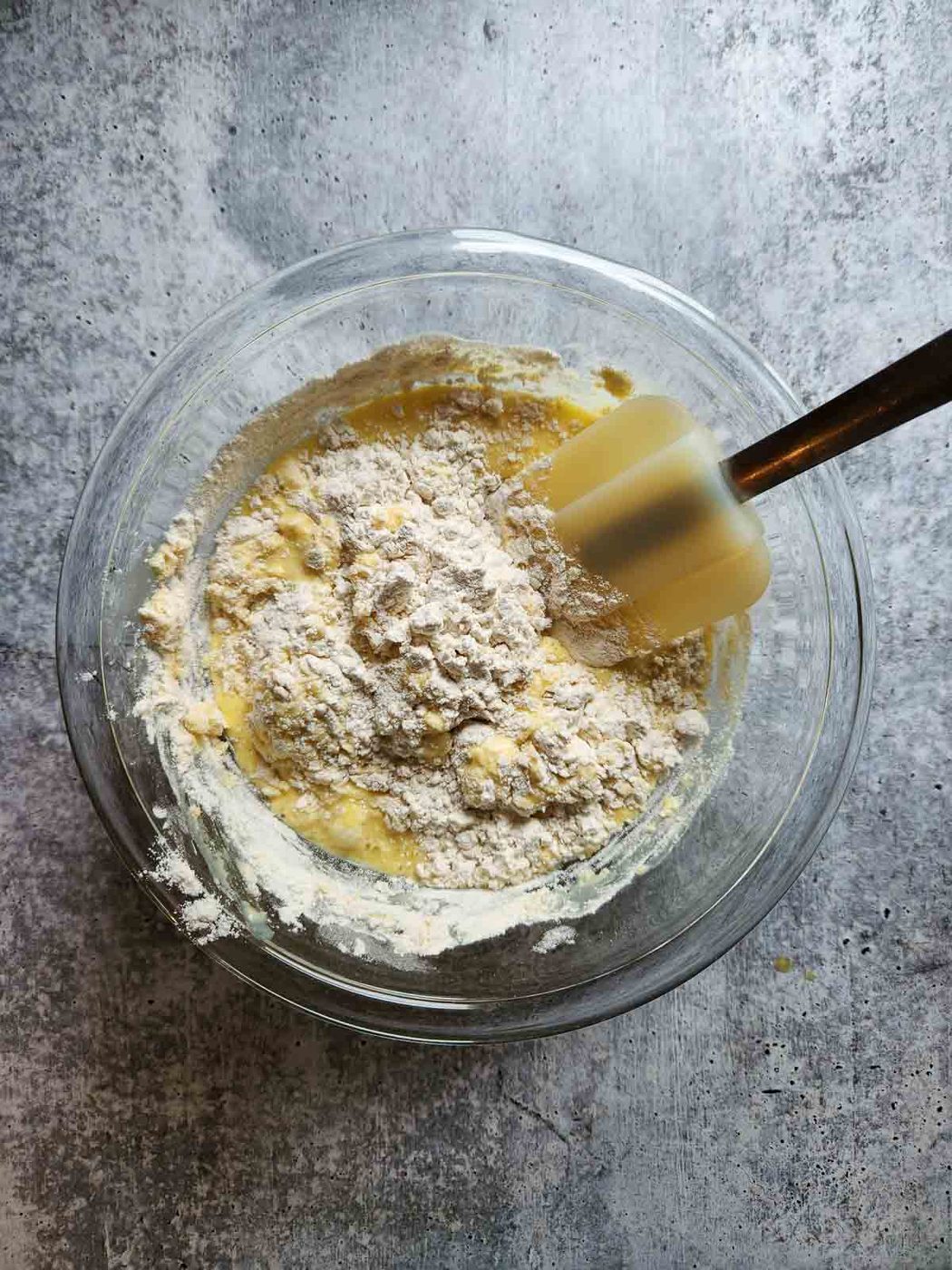 Mixing wet ingredients and dry ingredients for waffles.
