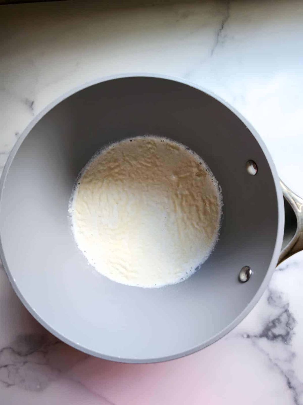 Gelatin sprinkled over half and half in a pot or panna cotta.