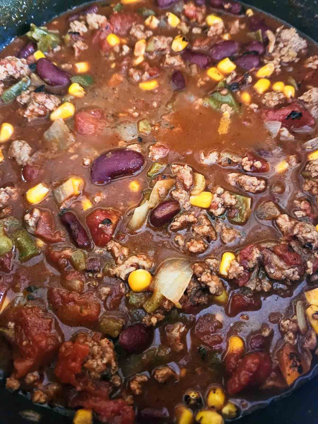 Fire-roasted chili in a pot.
