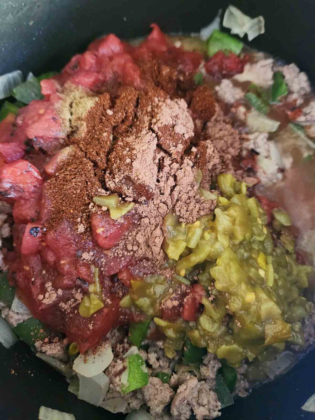 Ingredients for fire-roasted chili in a pot.