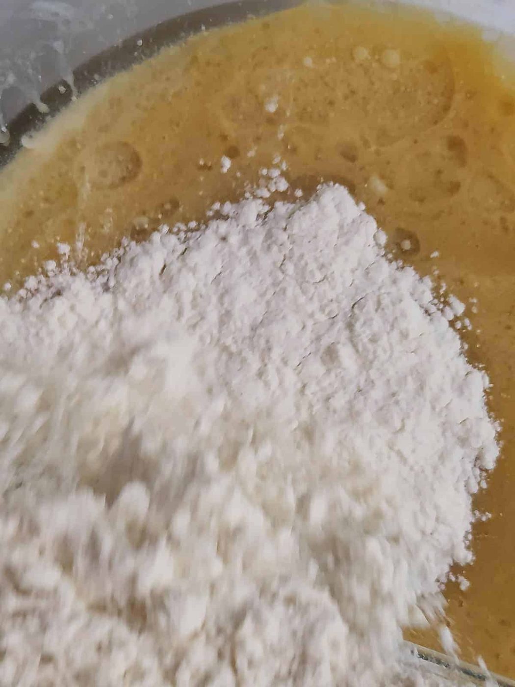 Dry ingredients mixed with wet ingredients for strawberry quick bread.