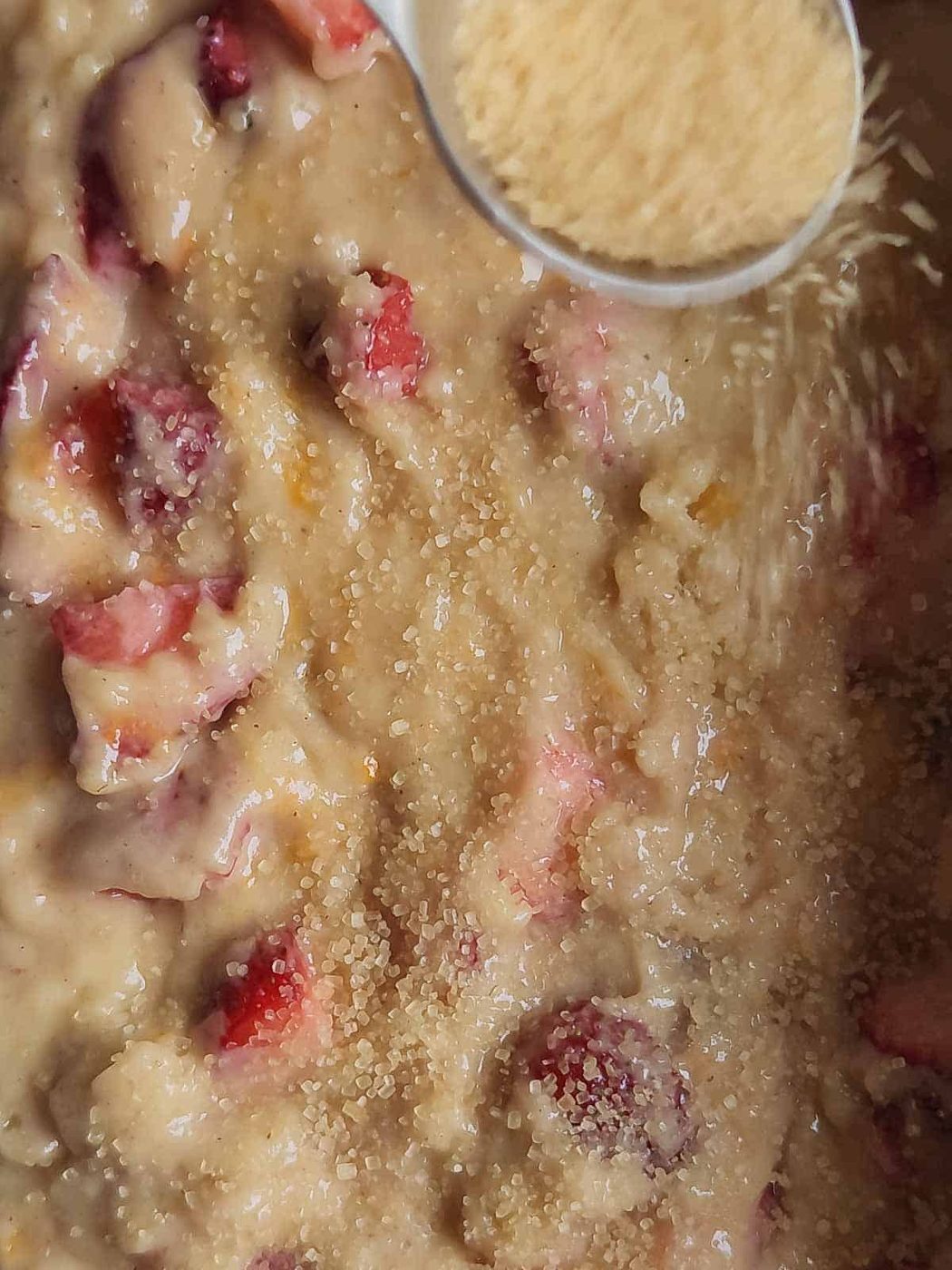 Turbinado sugar sprinkled on top on bread batter.