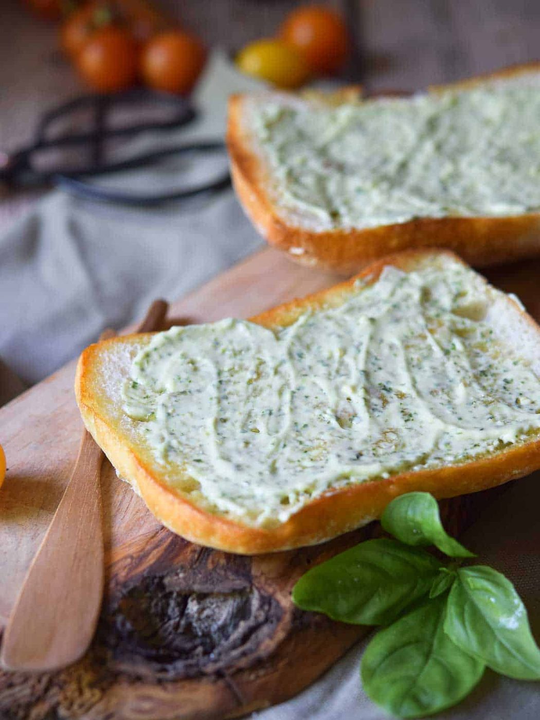 Two slices of bread with pesto aioli.