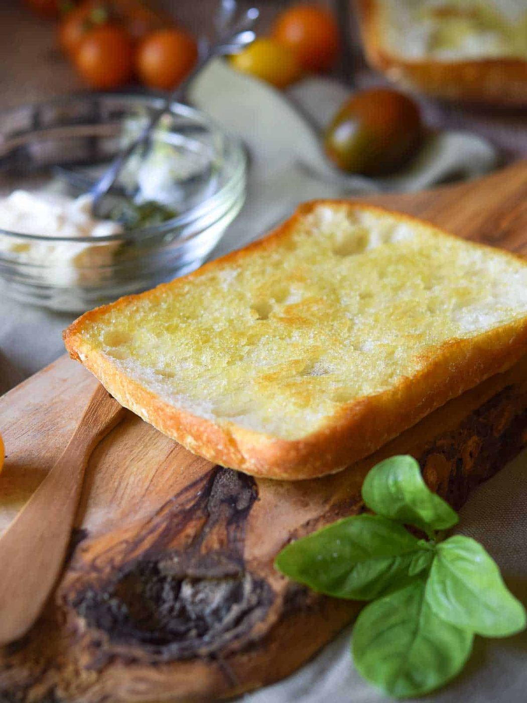 Toasted ciabatta on a wood board.