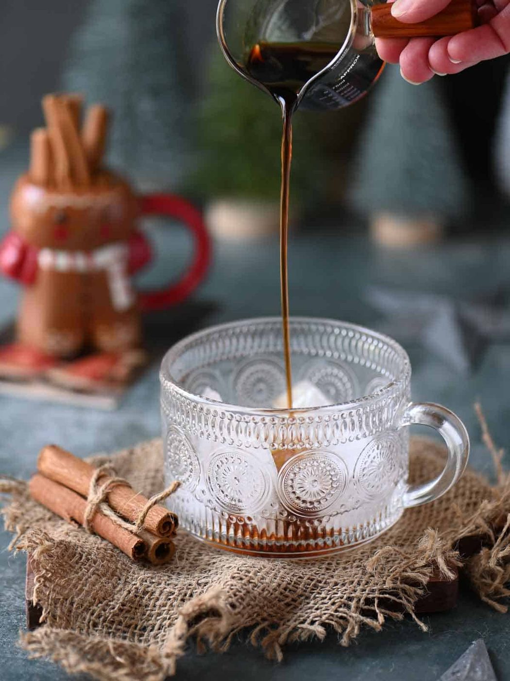 Coffee liqueur being pored into a clear glass.