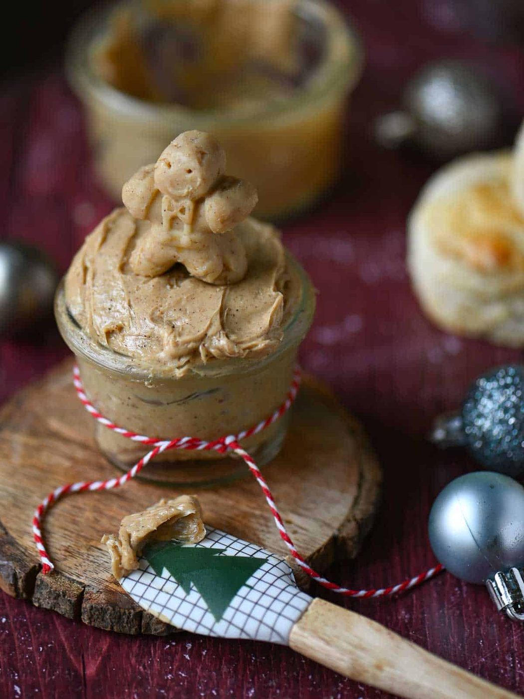 Gingerbread butter in a clear jar with a gingerbread man on top.
