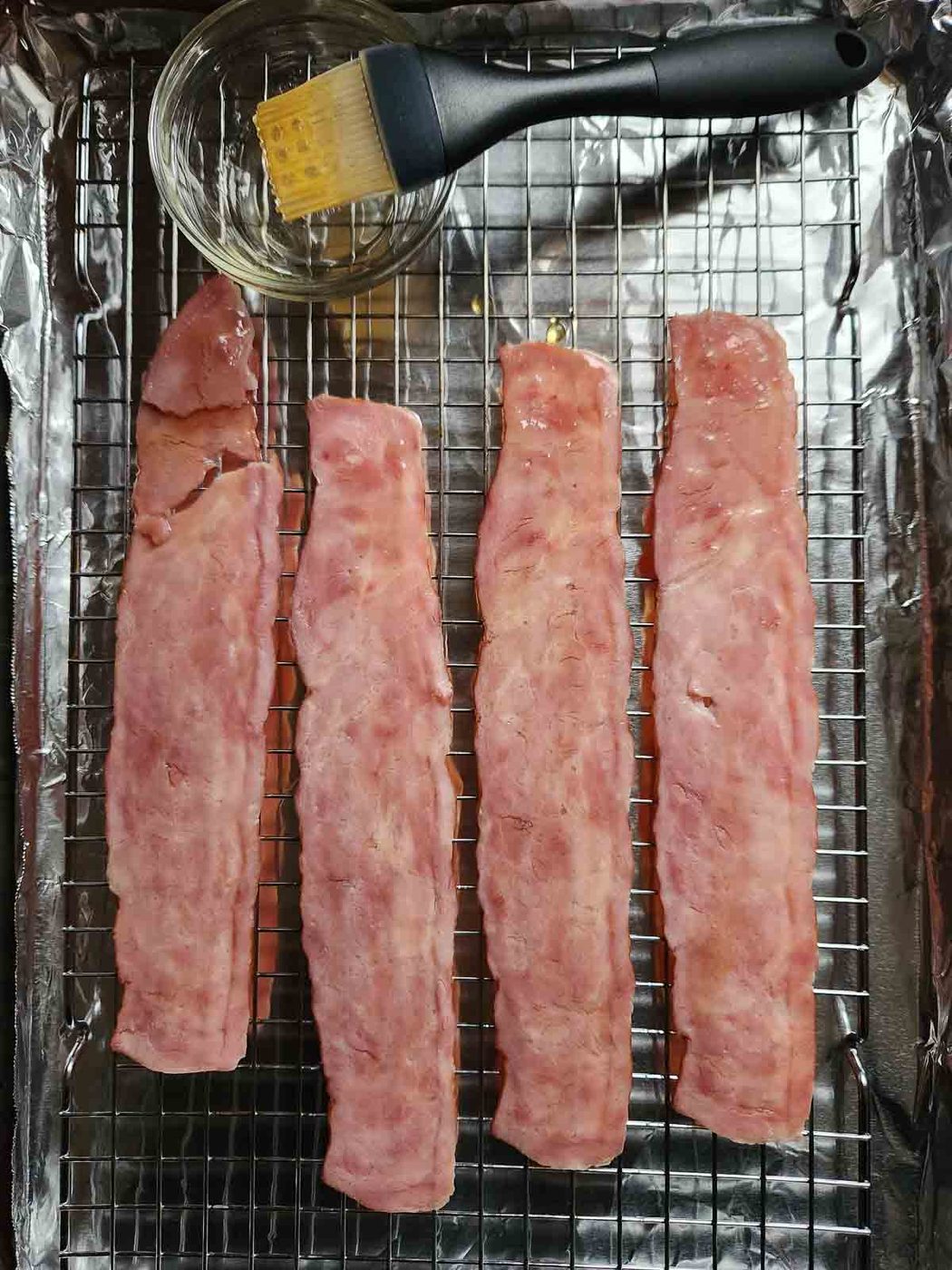 Turkey bacon on a wire rack and pan with honey.