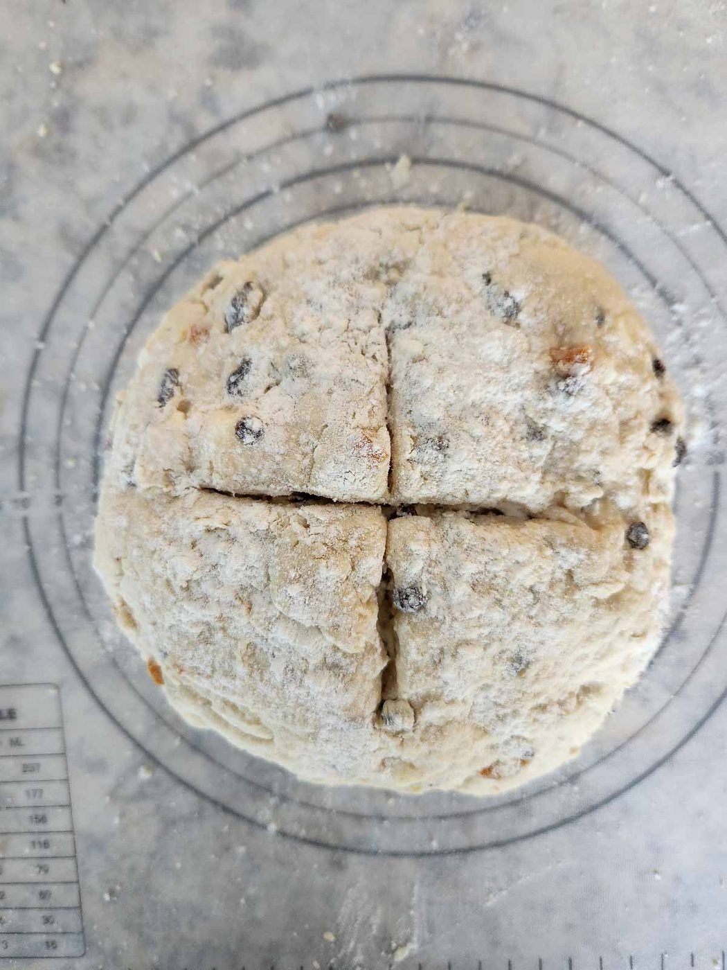 Irish soda bread dough on a baking mat.