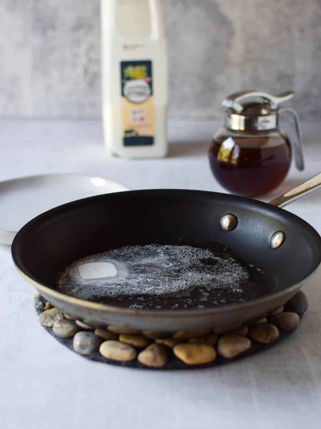 Sizzling butter in a frying pan.