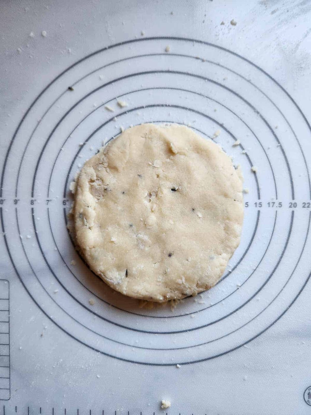 Lemon lavender shortbread dough on a baking mat.