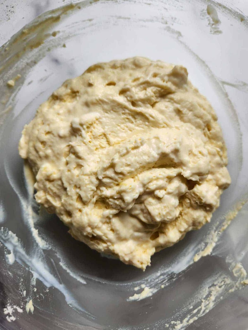 Pancake batter in a clear bowl.