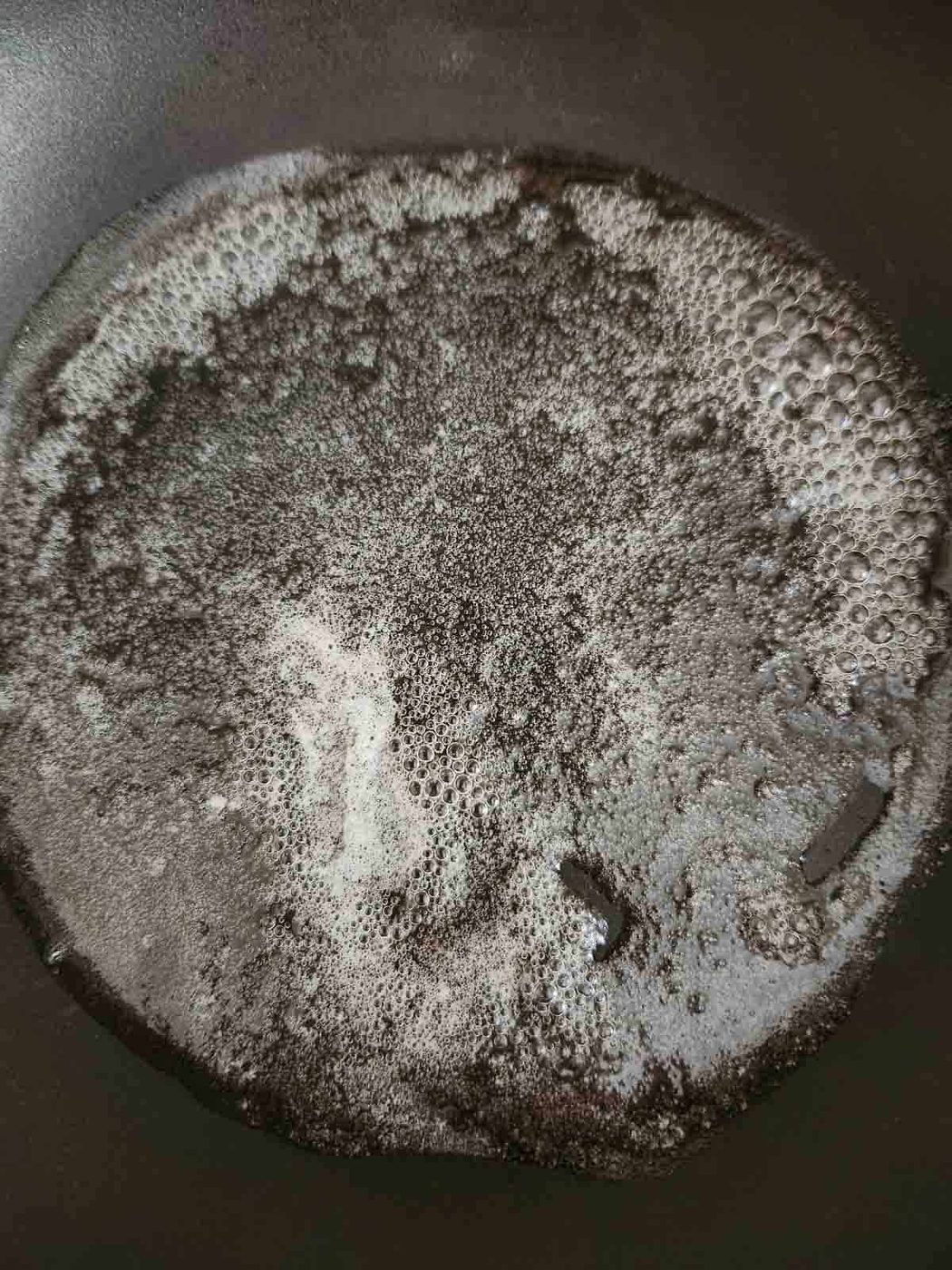 Foamed butter in a skillet.