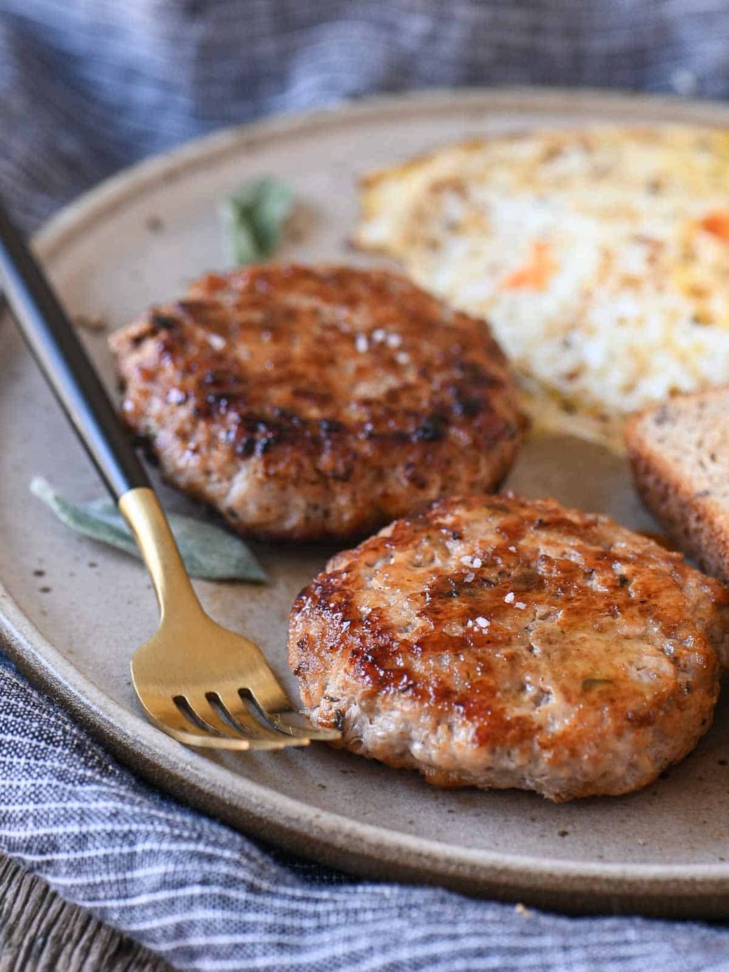 Delicious grilled breakfast sausage patties served with scrambled eggs and toasted bread at Cetoh.