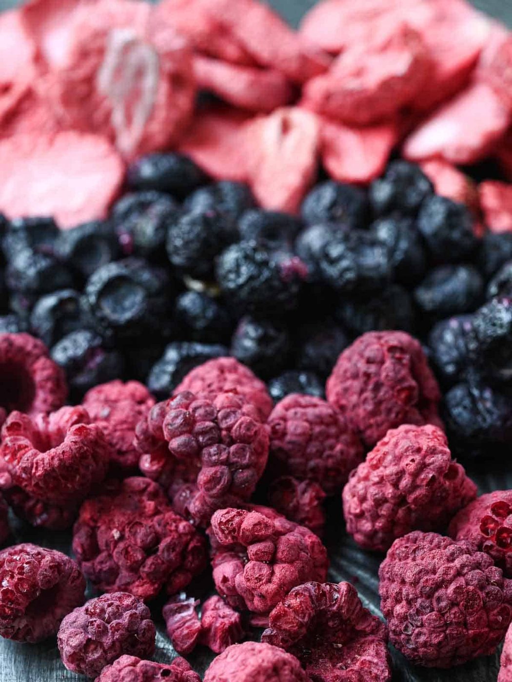 Close-up of freeze-dried raspberries, blueberries, and strawberries.