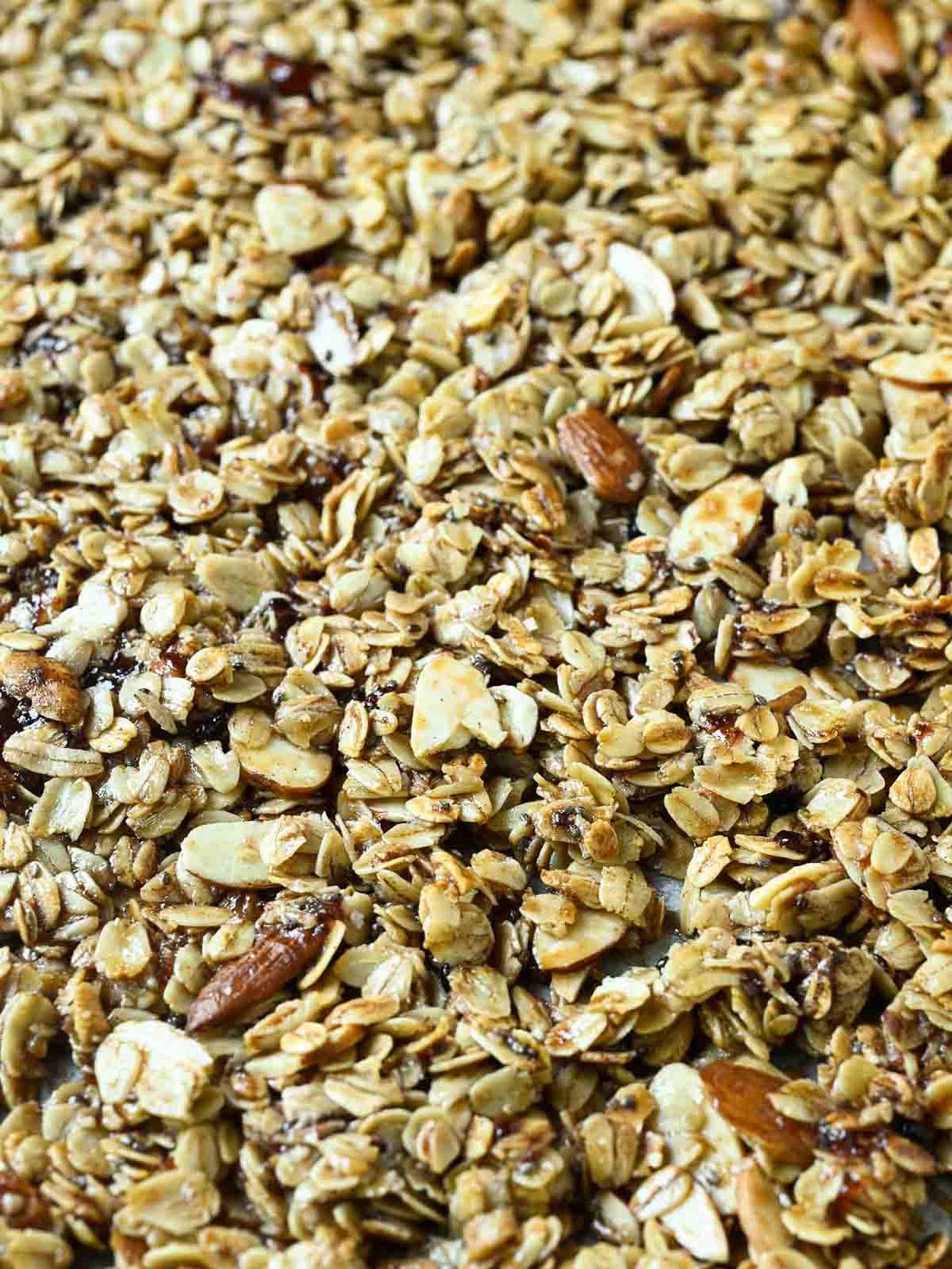 Close-up of cooked granola on a baking sheet.