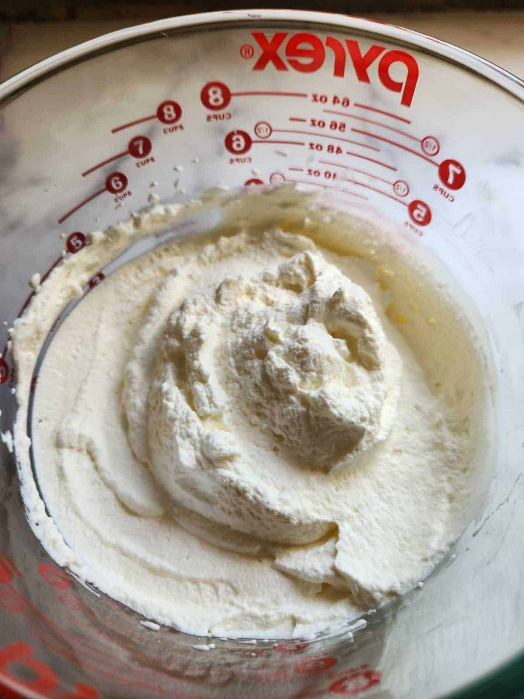 Heavy whipped cream in a bowl.