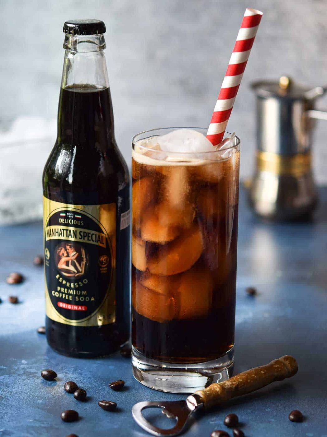 Homemade espresso soda next to a Manhattan Special drink.