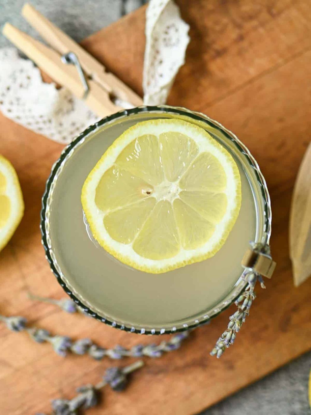 Overhead of lemonade in a glass with a straw.