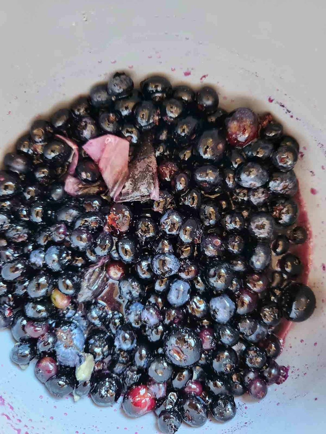 Blueberry jam simmering in a pot.
