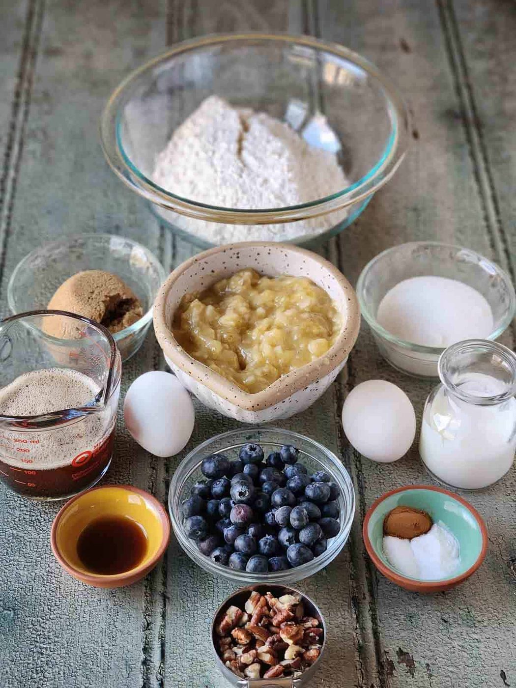 Ingredients in for blueberry banana bread in small bowls.