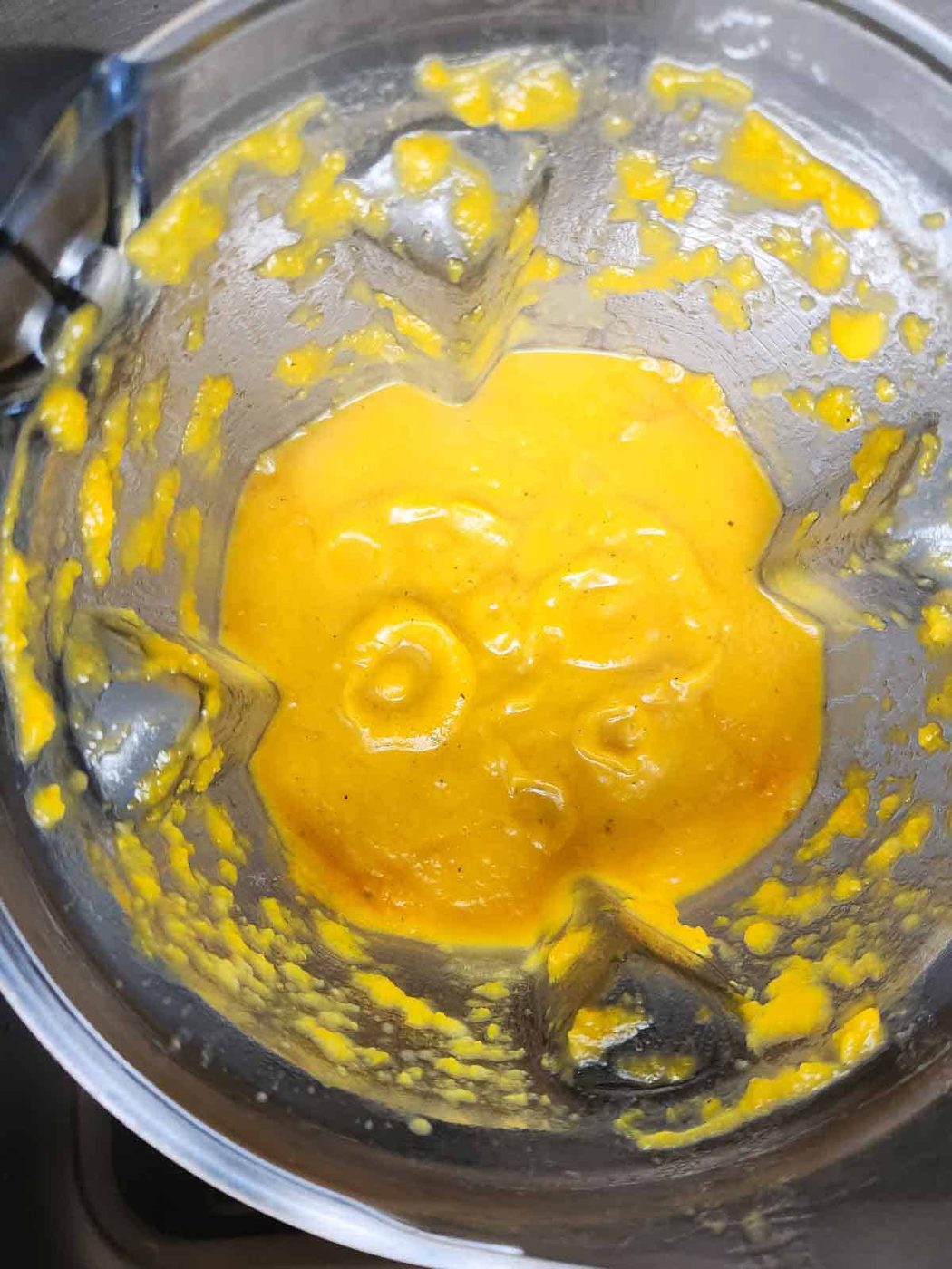 Pureed squash soup in a blender.