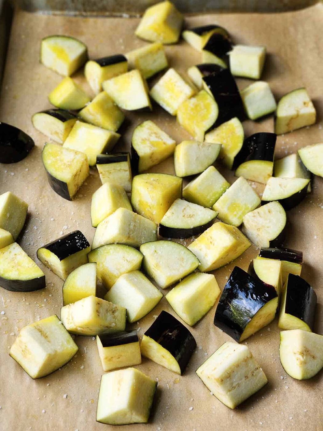 Chopped eggplant on parchment paper.