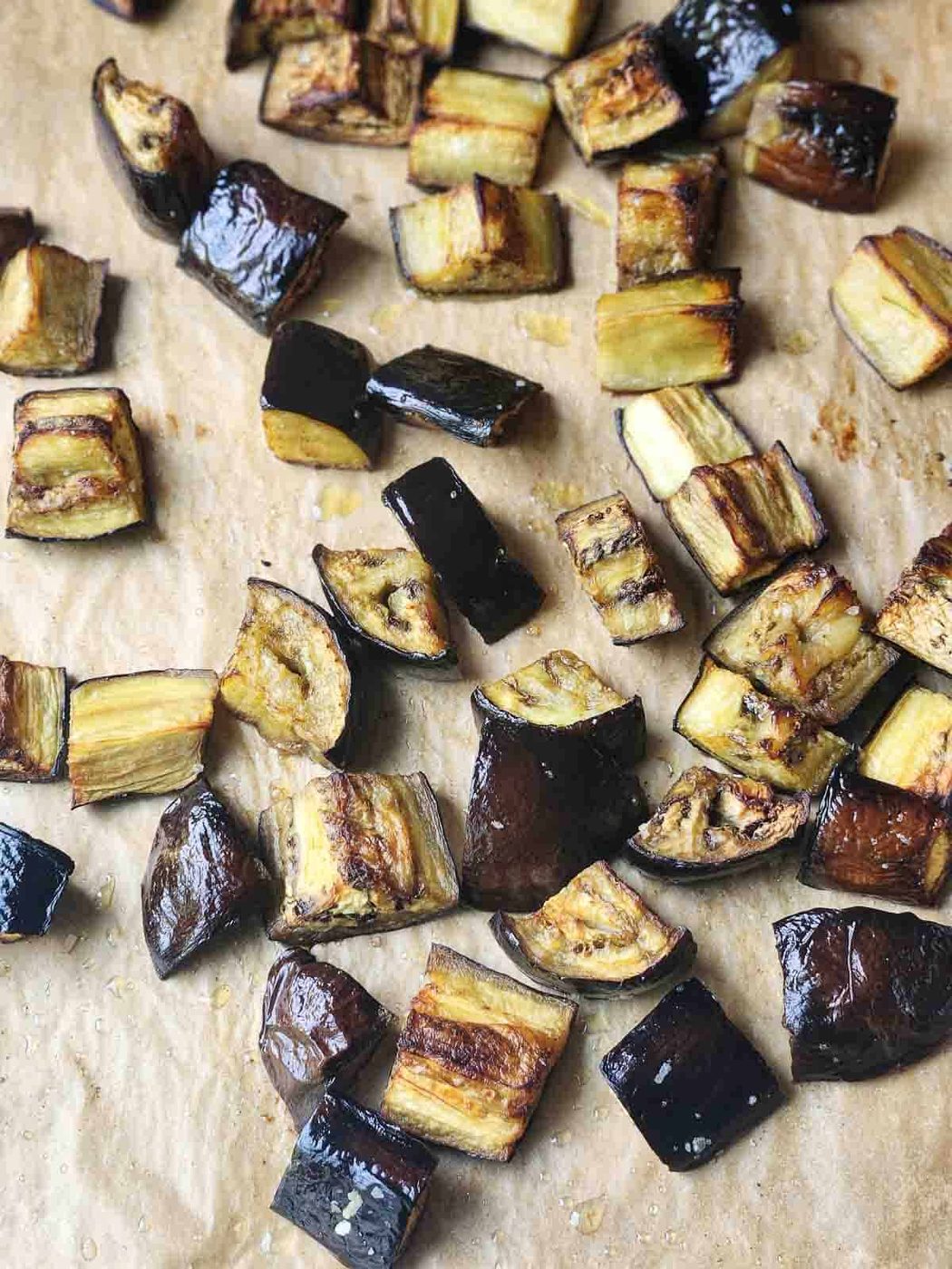 Roasted eggplant on parchment paper.