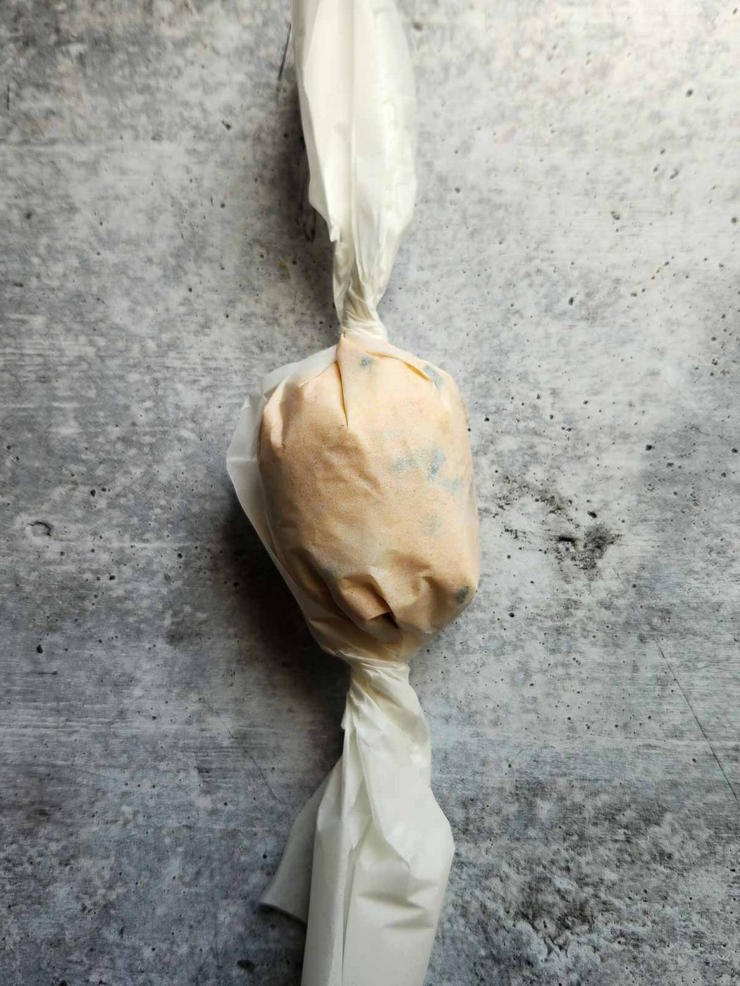 Butter wrapped in parchment paper.